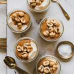 Salted Caramel Silken Tofu with Hazelnuts: silken tofu layered with salted caramel sauce and roasted hazelnuts.