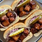 Discover how to make tender, flavorful Jackfruit Pulled “Turkey” sandwiches with BBQ sauce or mushroom gravy in this easy, plant-based recipe.